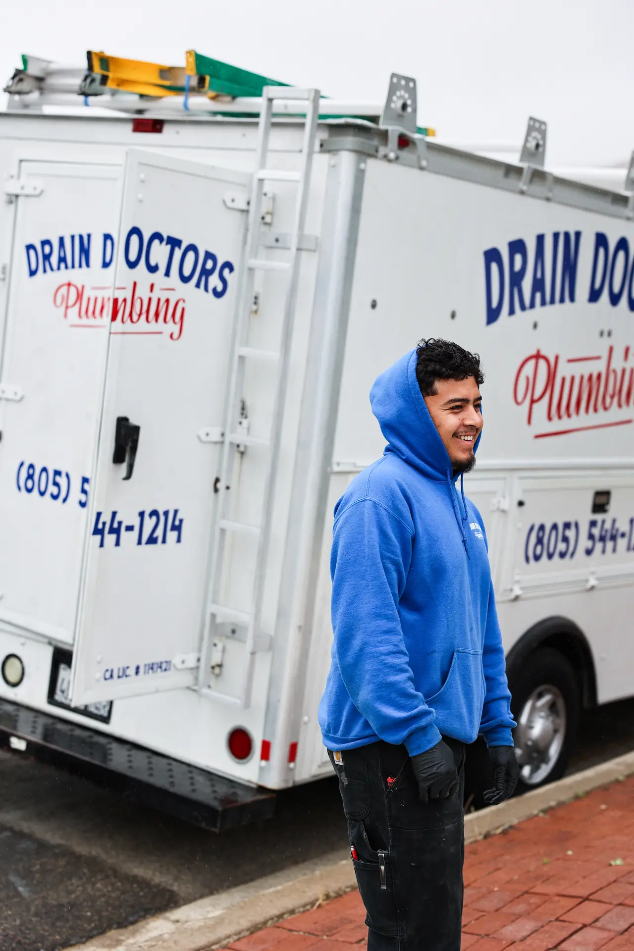 Drain Doctors Plumbing technician beside a service truck in San Luis Obispo