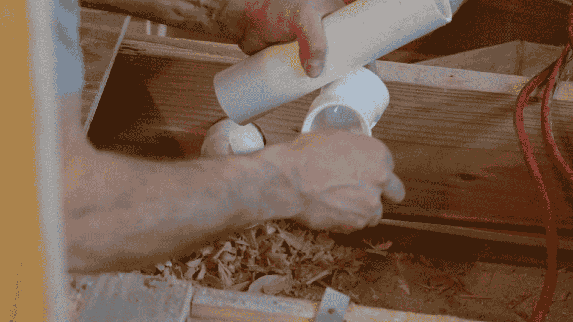 plumbing pipes and fittings representing professional plumbing services, Skilled plumber inspecting valves and drain connections with professional tools